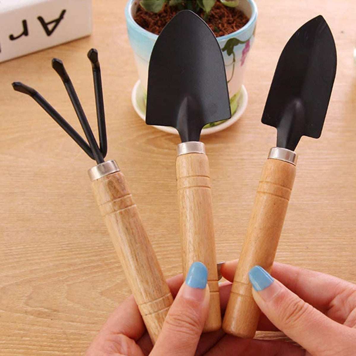 Ergonomic handles on the hand cultivator, trowel, and garden fork for comfort.
