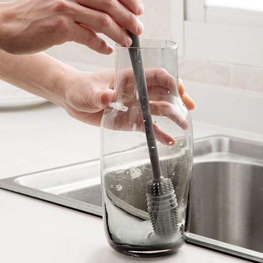 Multipurpose bottle cleaning brush with ergonomic handle for kitchen use.