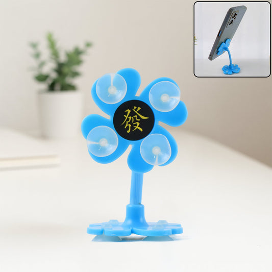 360¡ rotatable car phone holder with strong suction base displayed in a car.